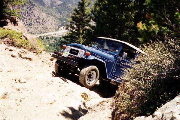 Gene's bone stock 1982 FJ40 makes easy work of the ledge