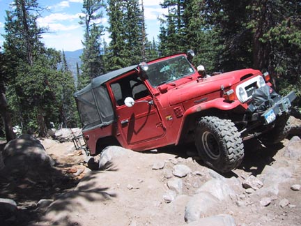 Neil crawls over the boulders with ease